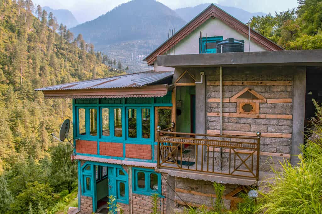 Close-up of traditional Kath-Kuni architectural style in Himachal Pradesh, showcasing intricate wood and stone work without cement.