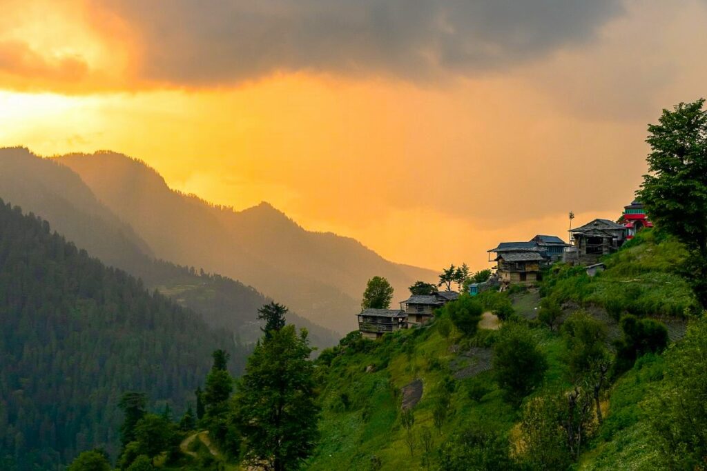 Golden sunset over the mountains and valley surrounding Jibhi, Himachal Pradesh.